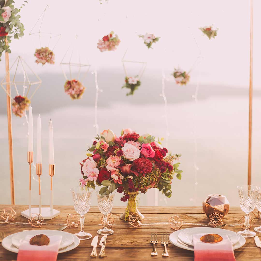 Romantic tablescape with blush and burgundy centerpiece